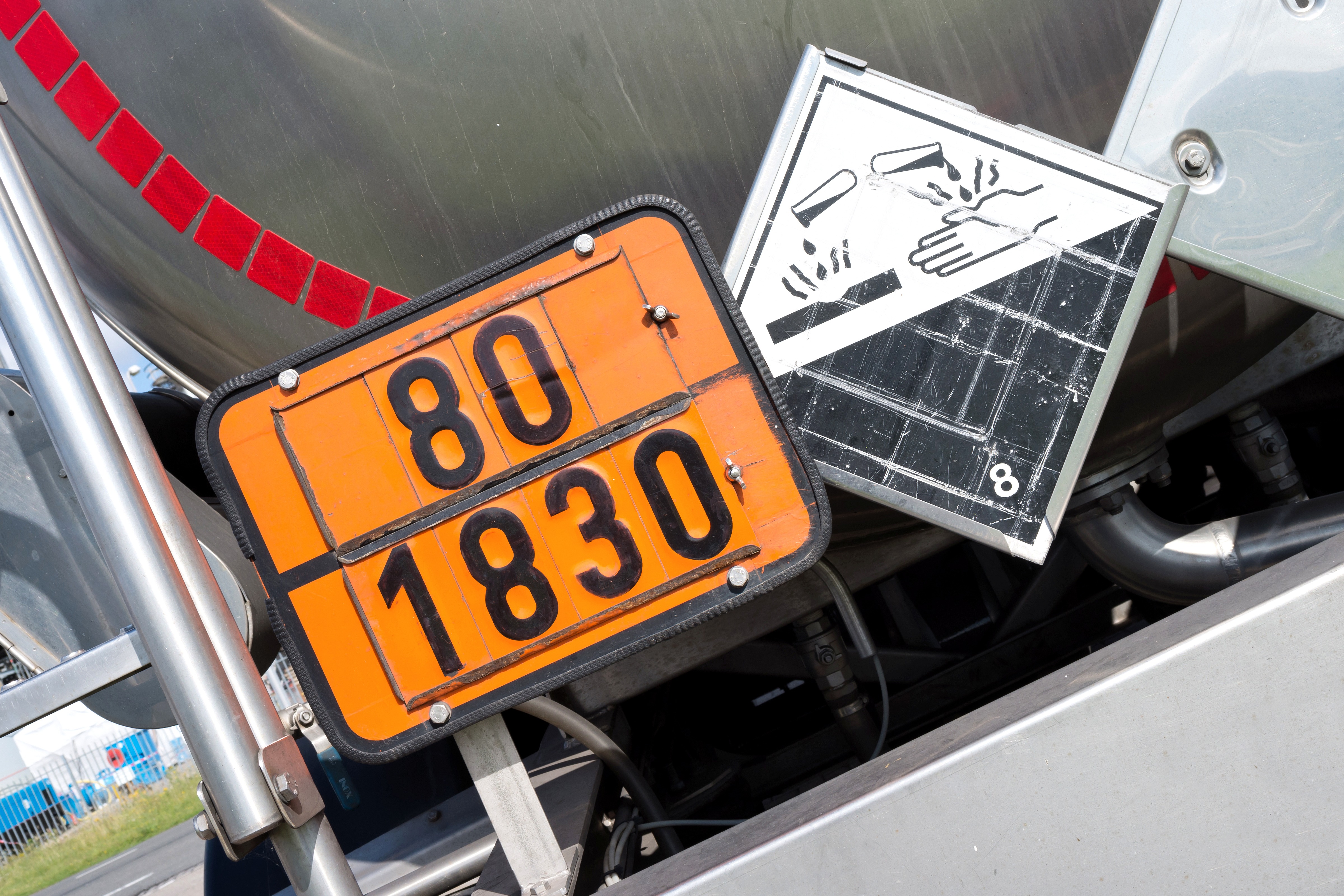 Hazard warning sign and reflective ADR plate of a chemical transporting truck