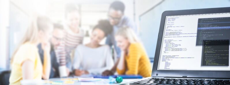 data-protection-compliance-dqs-a team works together to develop programs with a laptop